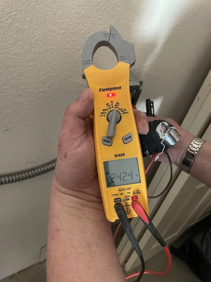 Voltage testing with clamp meter during Outlet Installation in Ayden
